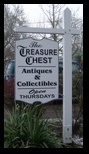 A freestanding, hanging MDO sign for The Treasure Chest